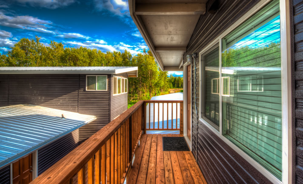 Metal Siding and a wood deck.