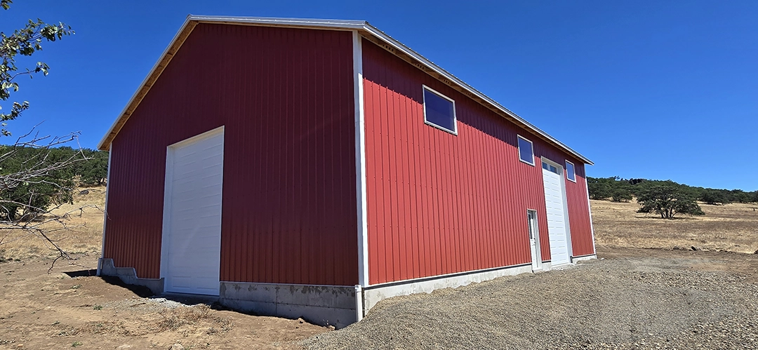 This Nor-Clad® Barn in Goldendale, WA uses ASC Building Products' Rustic Red for siding, Desert Beige for roofing and Winter White for the trim.