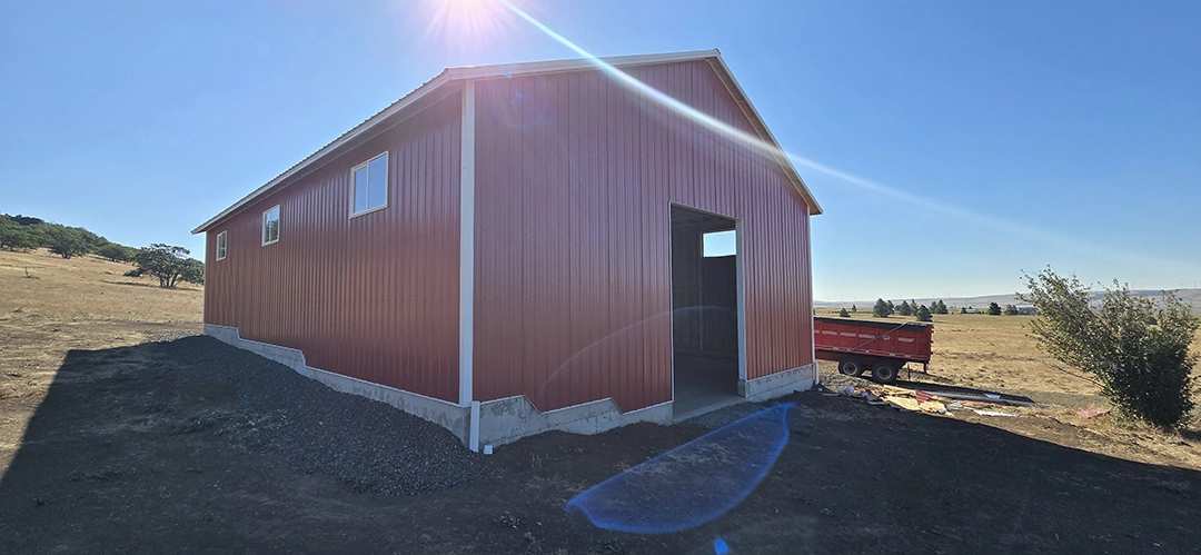This Nor-Clad® Barn in Goldendale, WA uses ASC Building Products' Rustic Red for siding, Desert Beige for roofing and Winter White for the trim.