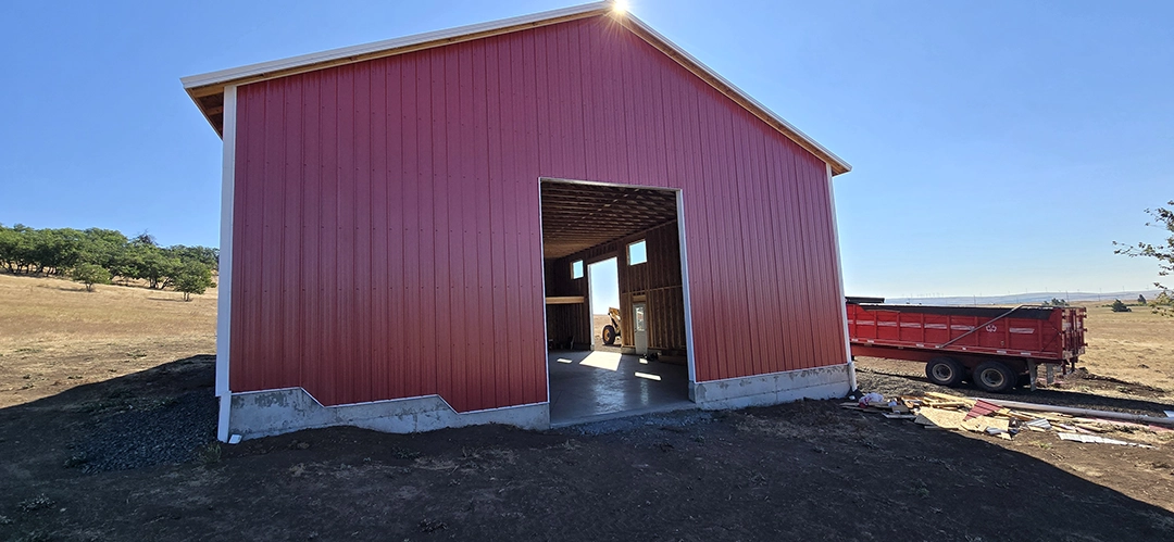 This Nor-Clad® Barn in Goldendale, WA uses ASC Building Products' Rustic Red for siding, Desert Beige for roofing and Winter White for the trim.
