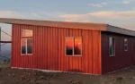 This Nor-Clad® cabin in High Prarie, WA uses Rustic Red and Old Zinc Gray DTxl to create a traditional looking cabin that will last for years.