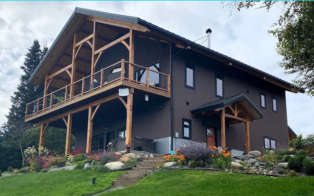 This residential home in Homer, AK features AEP Span's Nu-Wave Corrugated® in Natural Matte & ZINCALUME® siding colors.