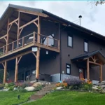 This residential home in Homer, AK features AEP Span's Nu-Wave Corrugated® in Natural Matte & ZINCALUME® siding colors.