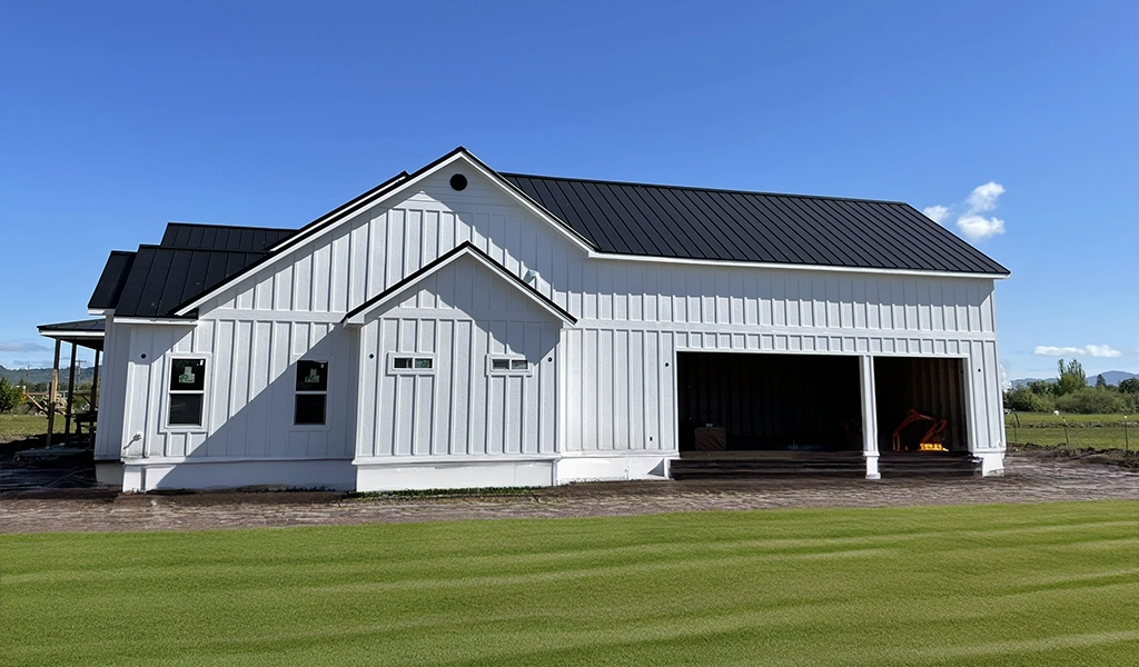 Black & White Residential Home in Southern Oregon featuring ASC Building Products' Skyline Roofing® in a Matte Black finish.