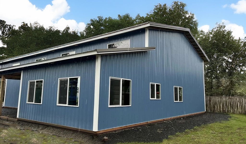 Residential Shop with Office in Westport. WA featuring ASC Building Products' Nor-Clad® Metal Siding in a Tahoe Blue with Winter White Trim.