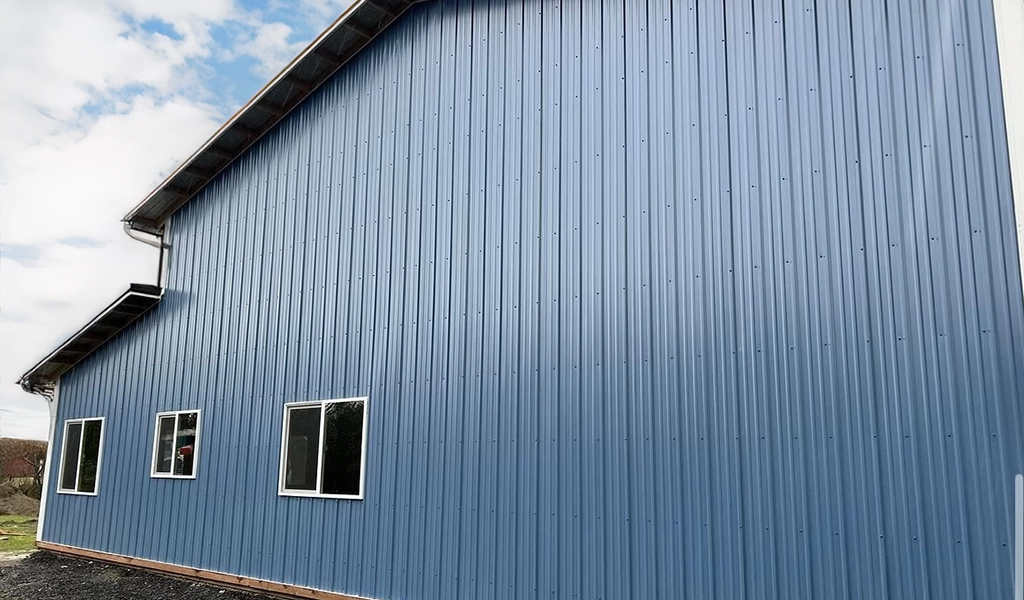 Residential Shop with Office in Westport. WA featuring ASC Building Products' Nor-Clad® Metal Siding in a Tahoe Blue with Winter White Trim.