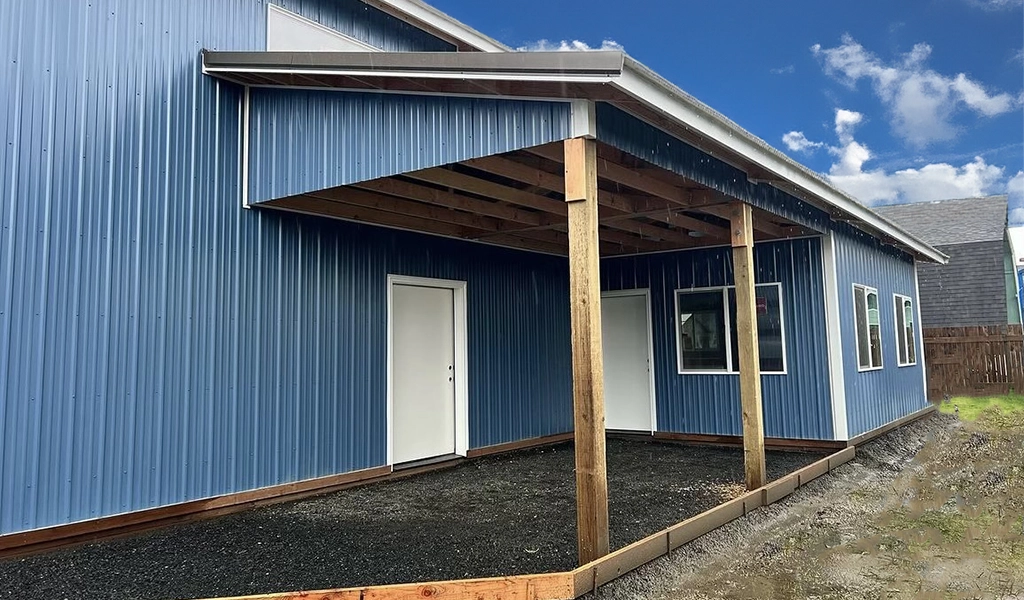 Residential Shop with Office in Westport. WA featuring ASC Building Products' Nor-Clad® Metal Siding in a Tahoe Blue with Winter White Trim.